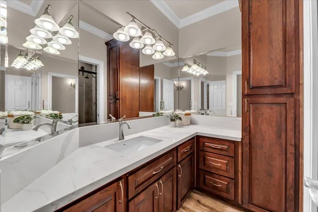 a bathroom with a sink double vanity and a mirror