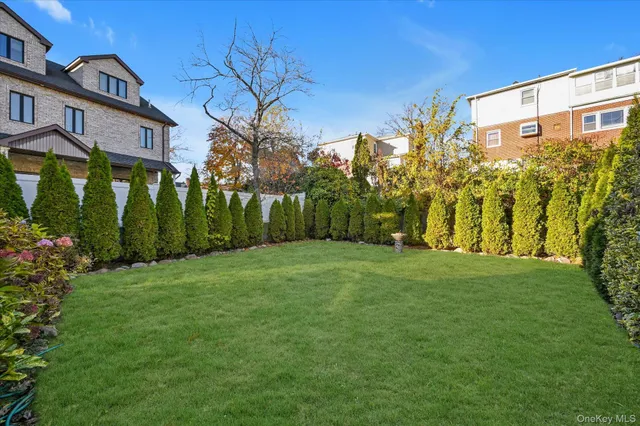 a backyard of a building with large trees