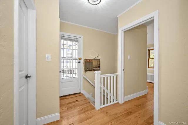 a view of a bedroom from a hallway