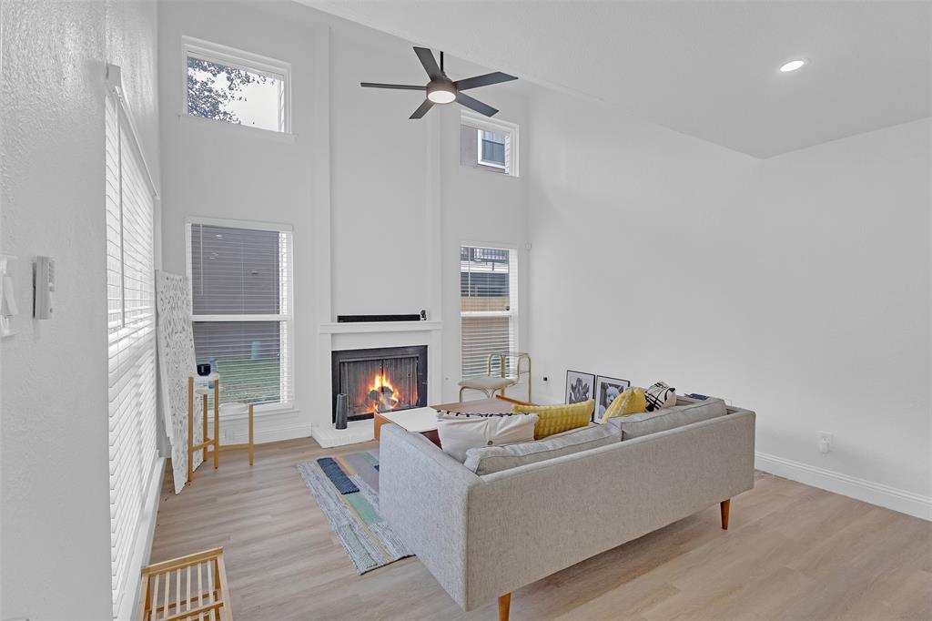 5516 Boca Raton Boulevard, Unit 321 Fort Worth, TX 76112 - Photo 3 of 25 LIVING ROOM WITH WOOD BURNING-FIREPLACE