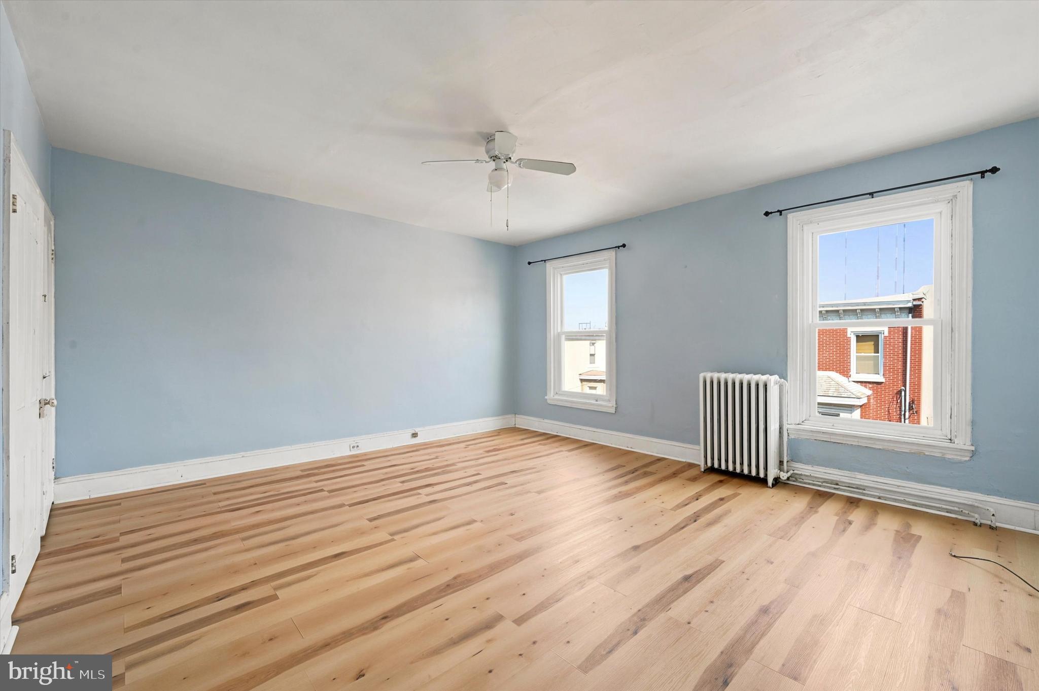 204 Ripka Street, Unit 2 Philadelphia, PA 19127 - Photo 9 of 22 a view of empty room with wooden floor and fan
