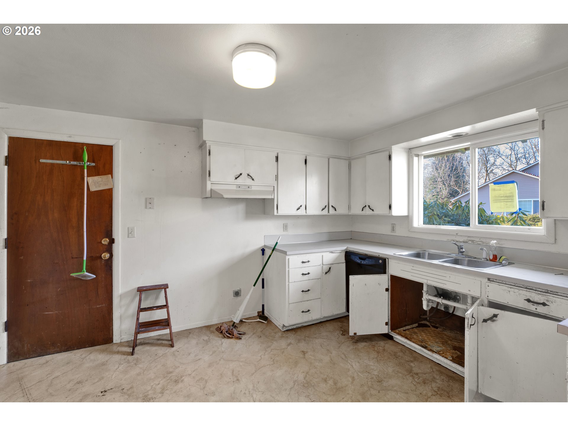 3307 Arrowhead Street Eugene, OR 97404 - Photo 21 of 46 a kitchen with a sink cabinets and window