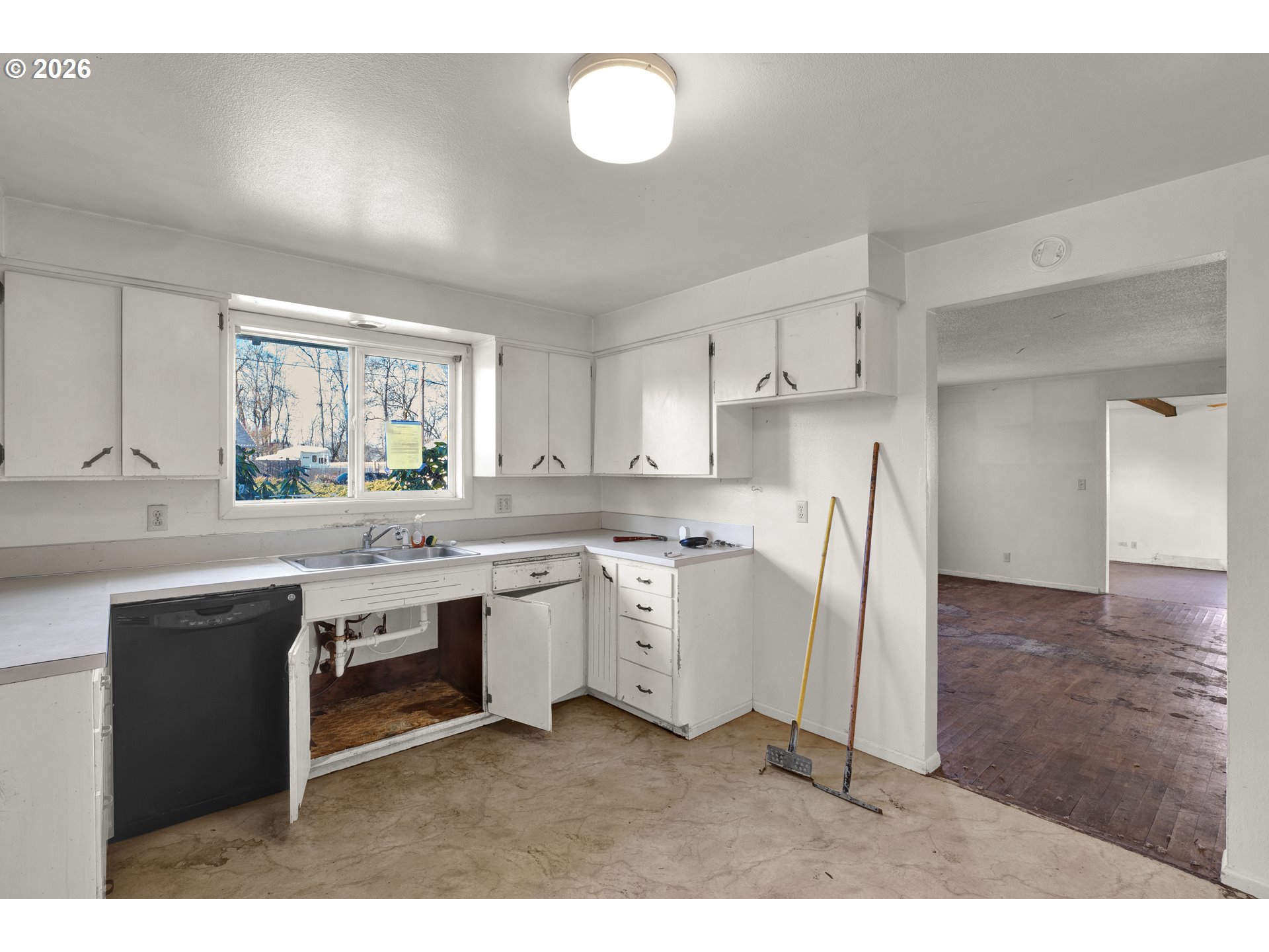 3307 Arrowhead Street Eugene, OR 97404 - Photo 22 of 46 a kitchen with refrigerator and cabinets