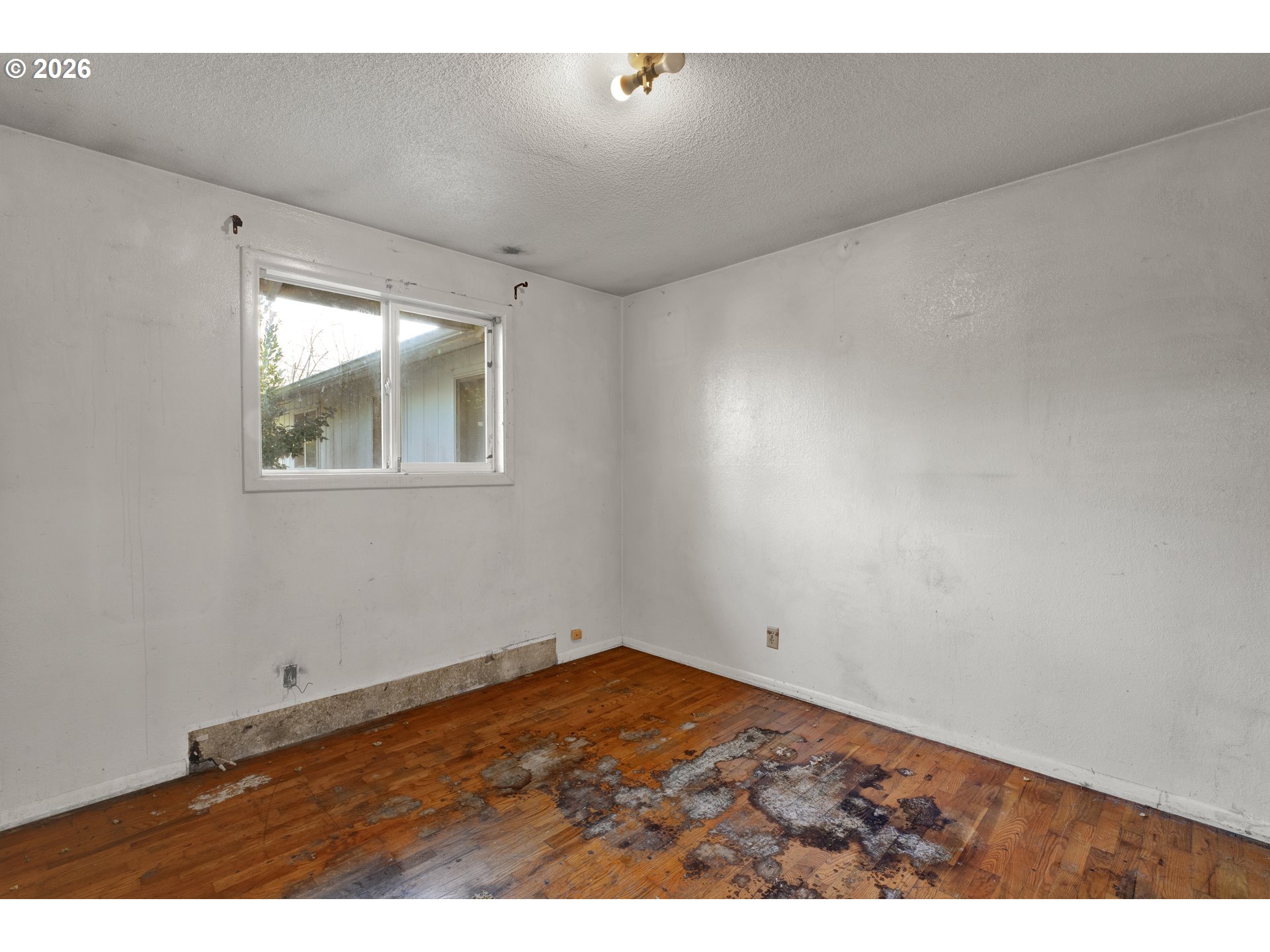 3307 Arrowhead Street Eugene, OR 97404 - Photo 30 of 46 a view of empty room with wooden floor
