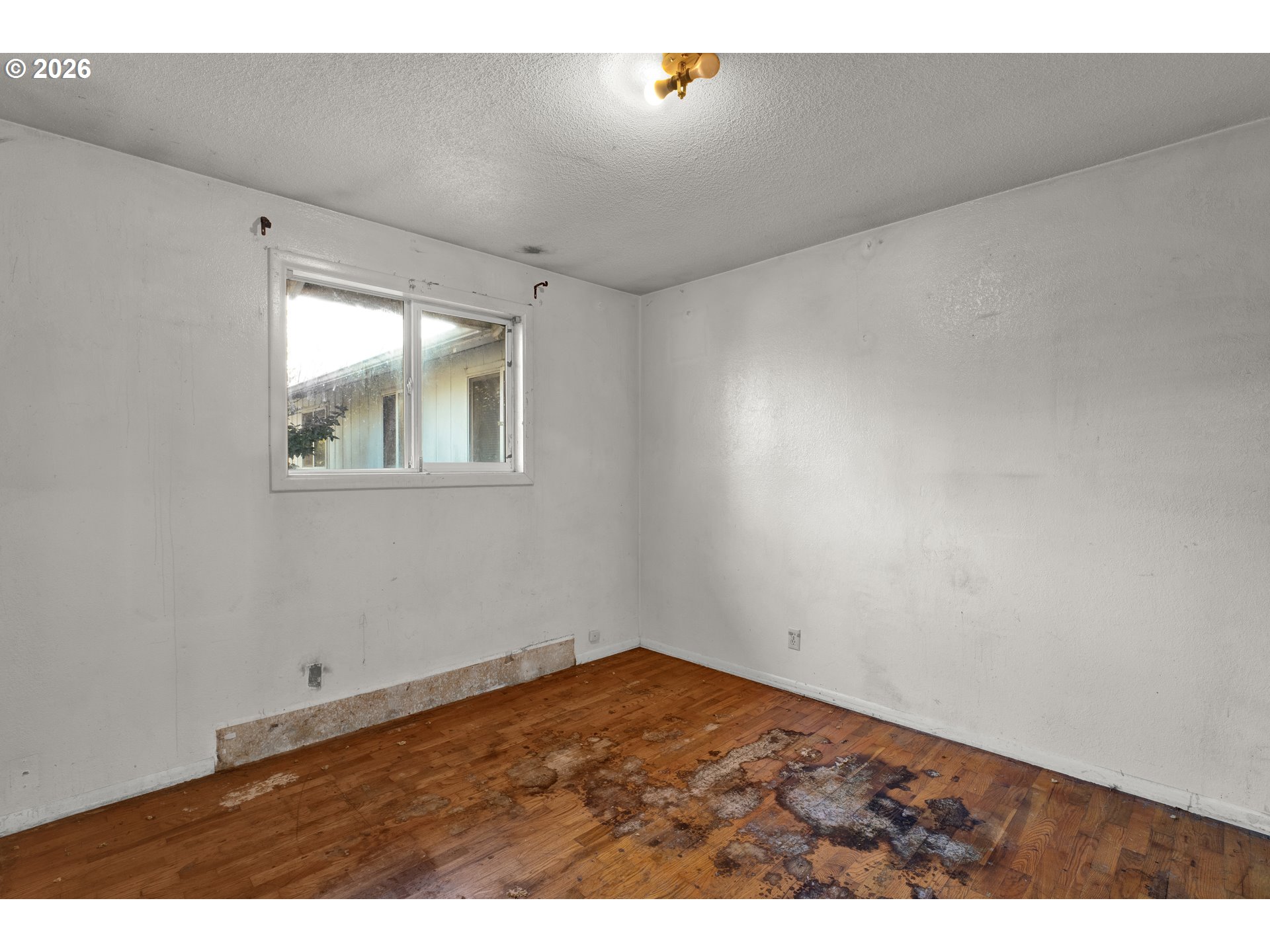 3307 Arrowhead Street Eugene, OR 97404 - Photo 32 of 46 a view of empty room with wooden floor