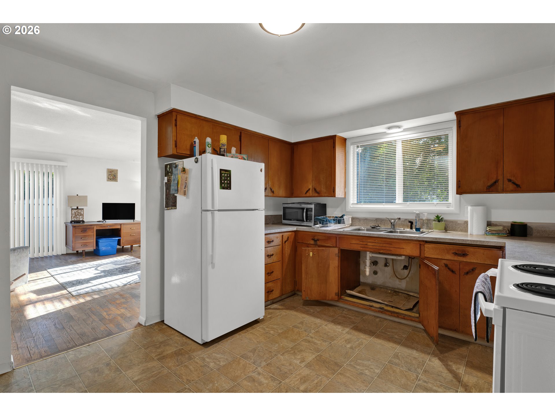 3307 Arrowhead Street Eugene, OR 97404 - Photo 7 of 46 a kitchen with refrigerator and cabinets