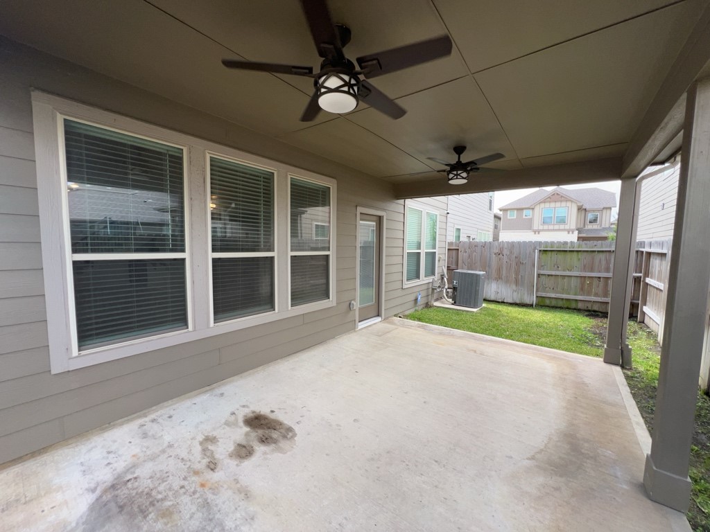5135 Emma Forest Street Houston, TX 77018 - Photo 26 of 28 a view of a porch with a floor to ceiling window and a flat screen tv