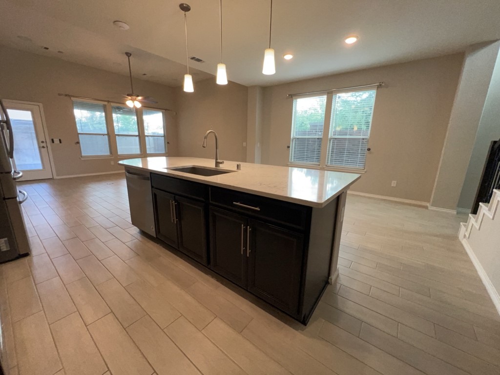 5135 Emma Forest Street Houston, TX 77018 - Photo 9 of 28 a kitchen with a sink a counter space appliances and wooden floor