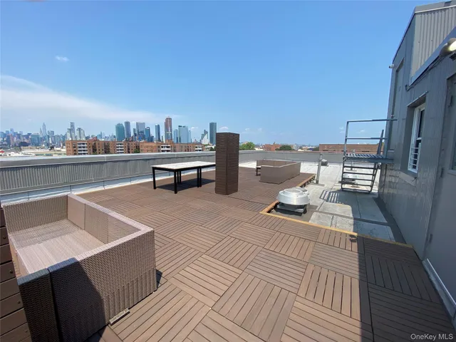 a view of a terrace with wooden floor and outdoor seating