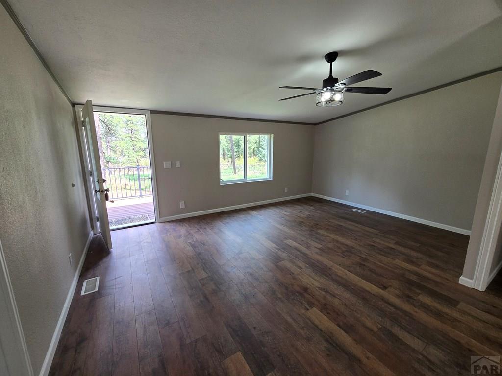 8229 Green Lane Rye, CO 81069 - Photo 4 of 24 wooden floor in an empty room with a window