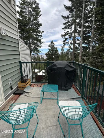 a view of balcony with furniture