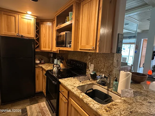 a kitchen that has a sink and a stove