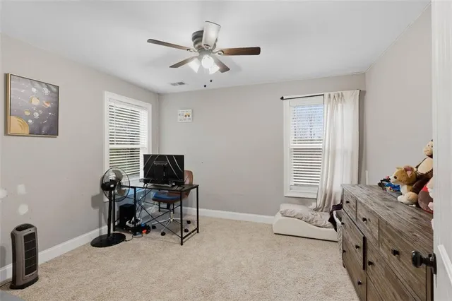 a bedroom with a workspace