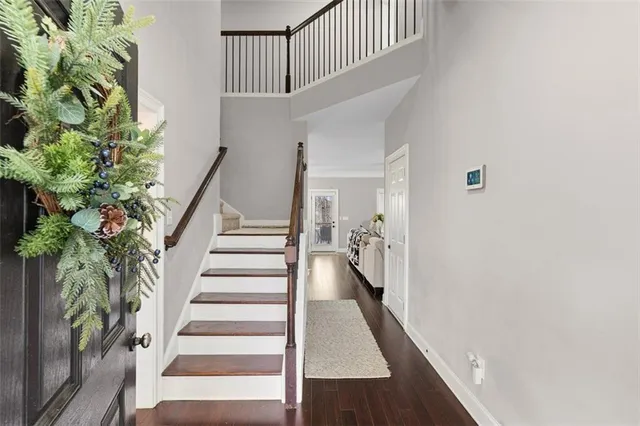 a view of entryway with wooden floor
