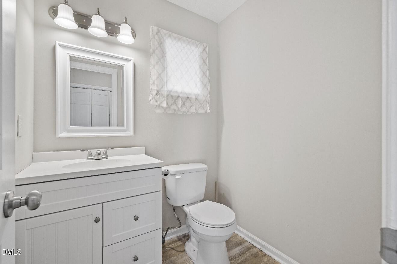 999 Flintwood Road Fayetteville, NC 28314 - Photo 11 of 23 a bathroom with a sink a toilet and mirror