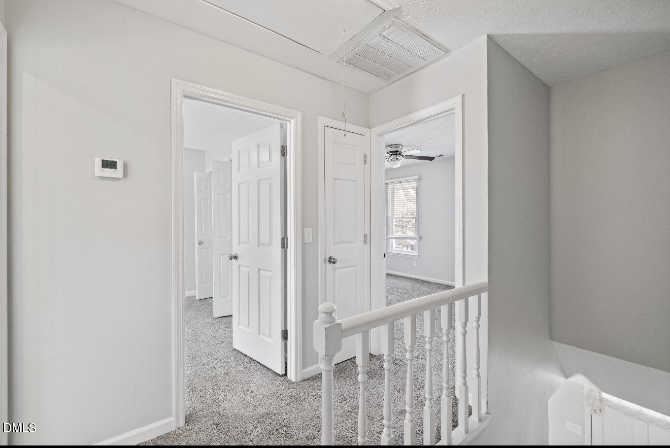 999 Flintwood Road Fayetteville, NC 28314 - Photo 13 of 23 a view of a hallway with wooden shelves