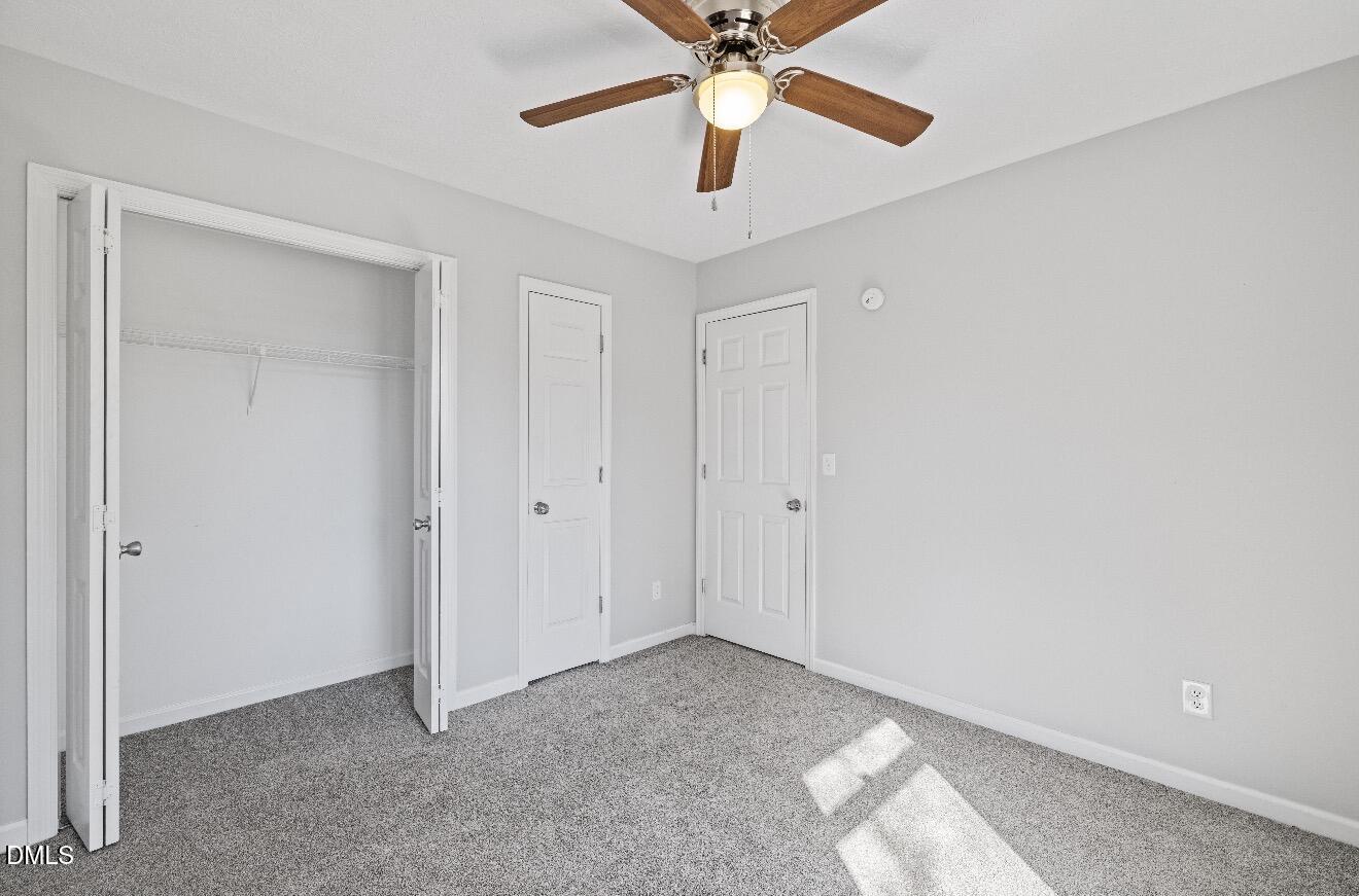 999 Flintwood Road Fayetteville, NC 28314 - Photo 14 of 23 a view of an empty room and chandelier fan
