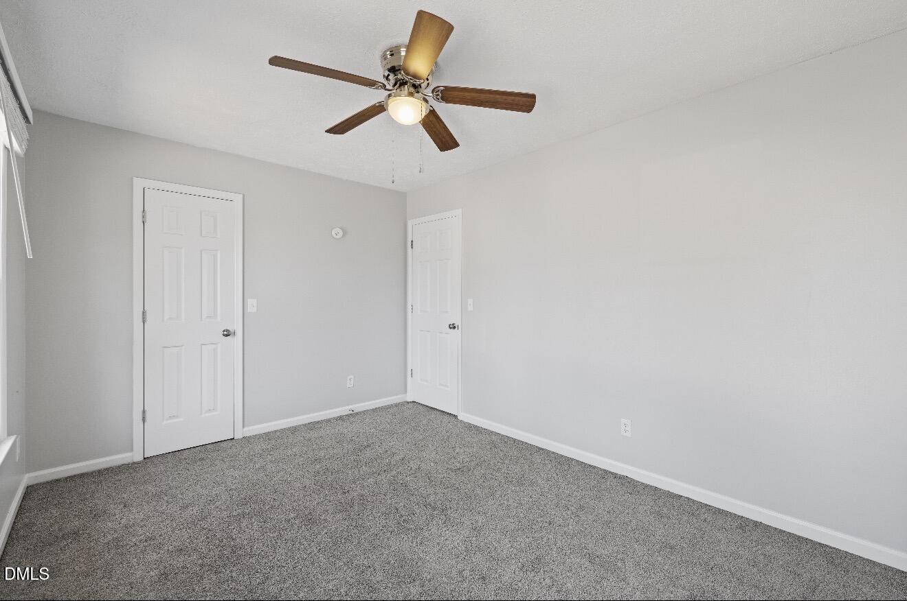 999 Flintwood Road Fayetteville, NC 28314 - Photo 15 of 23 a view of a room with a ceiling fan