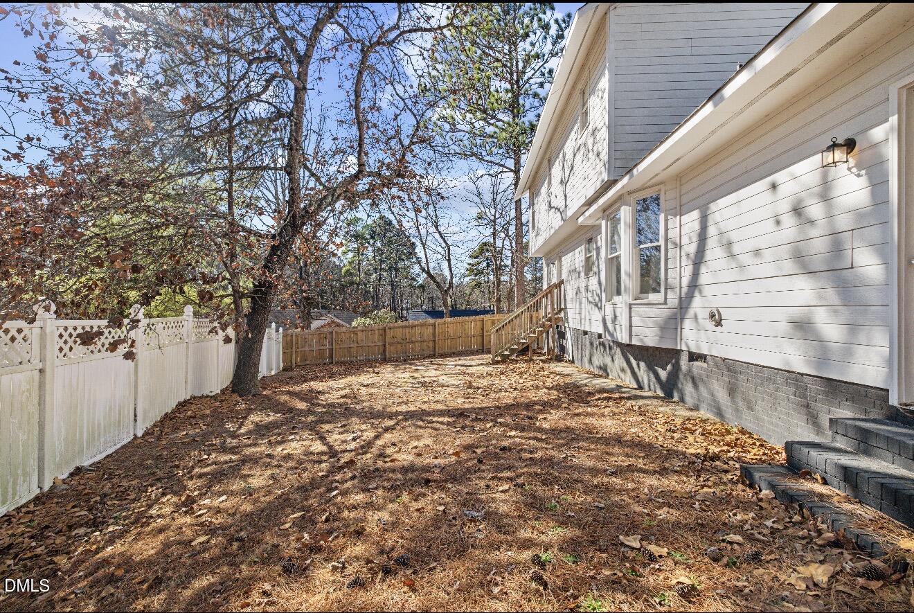 999 Flintwood Road Fayetteville, NC 28314 - Photo 21 of 23 a wooden bench sitting in front of house