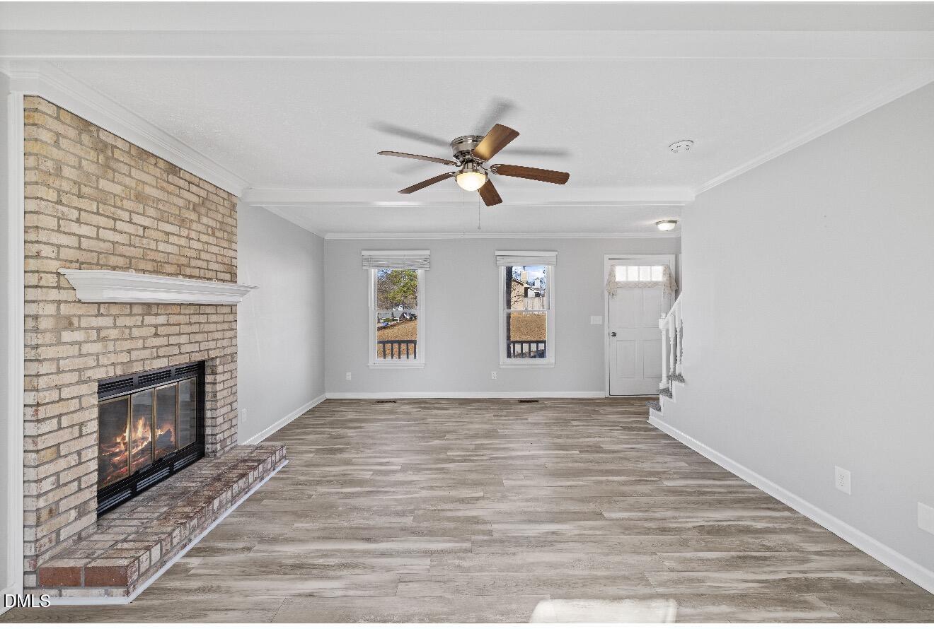 999 Flintwood Road Fayetteville, NC 28314 - Photo 4 of 23 an empty room with windows and fireplace