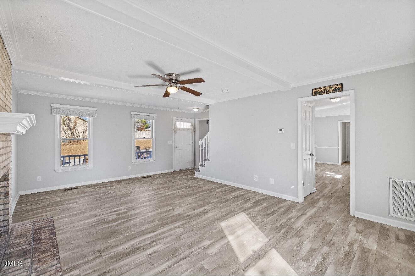 999 Flintwood Road Fayetteville, NC 28314 - Photo 5 of 23 a view of a livingroom with a window and wooden floor