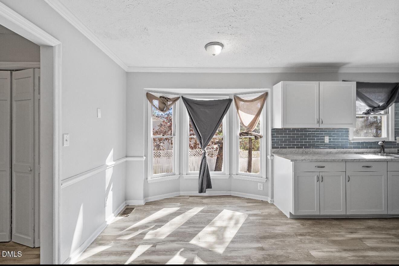 999 Flintwood Road Fayetteville, NC 28314 - Photo 9 of 23 a view of a kitchen from a hallway