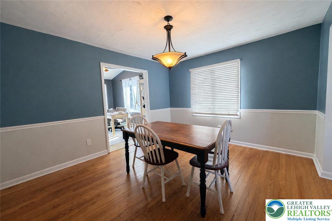 1060 Arbor Lane Slatington, PA 18080 - Photo 16 of 46 a view of a dining room with furniture and wooden floor