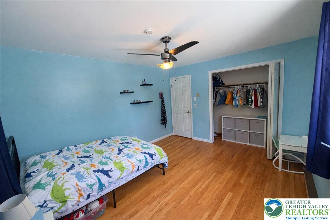 1060 Arbor Lane Slatington, PA 18080 - Photo 27 of 46 a bedroom with a bed and a chandelier