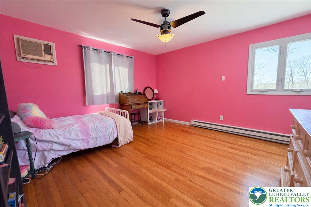 1060 Arbor Lane Slatington, PA 18080 - Photo 28 of 46 a bed room with a bed and a chair