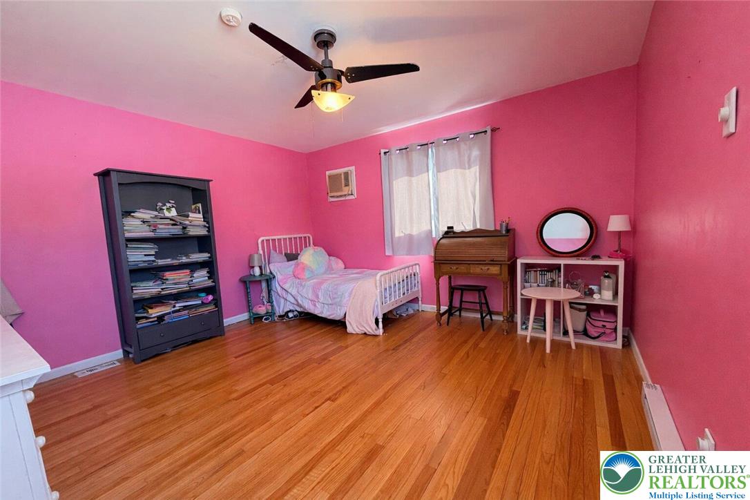 1060 Arbor Lane Slatington, PA 18080 - Photo 29 of 46 a bed room with a bed and a chair