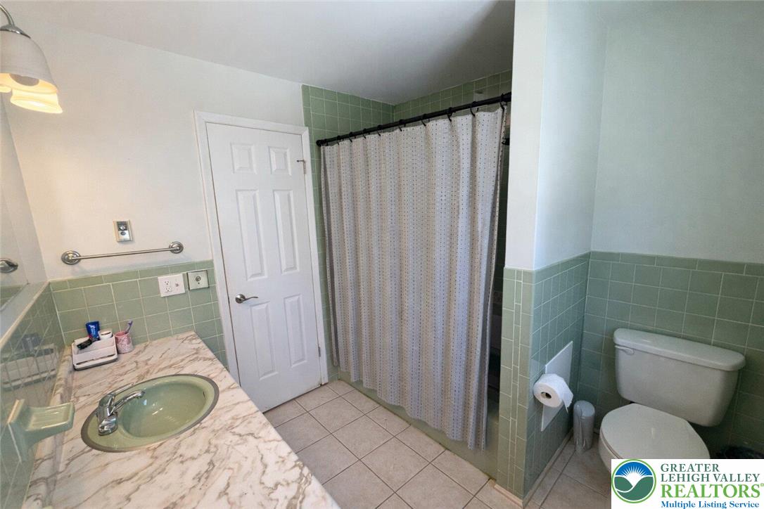 1060 Arbor Lane Slatington, PA 18080 - Photo 36 of 46 a bathroom with a toilet and a sink