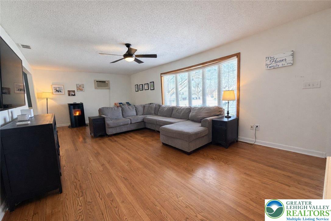 1060 Arbor Lane Slatington, PA 18080 - Photo 4 of 46 a living room with furniture and a flat screen tv
