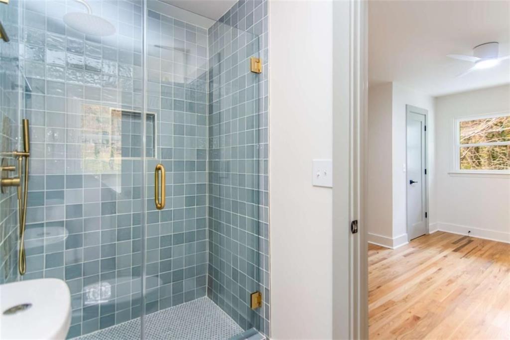 4956 Mountclaire Road Stone Mountain, GA 30087 - Photo 37 of 61 a bathroom with a shower
