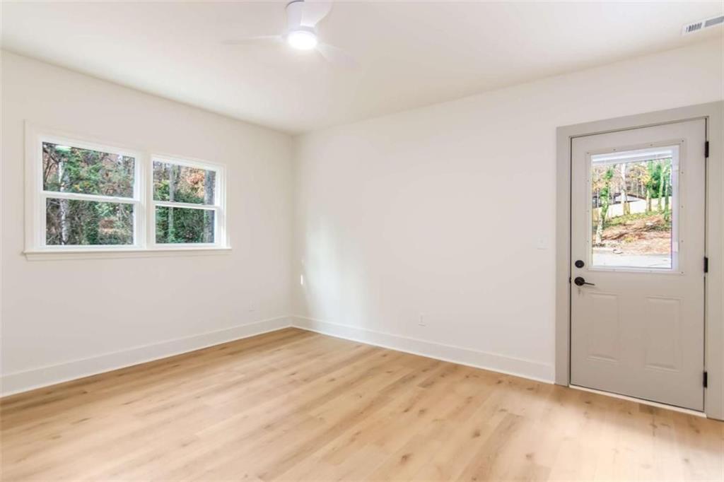 4956 Mountclaire Road Stone Mountain, GA 30087 - Photo 52 of 61 an empty room with a window