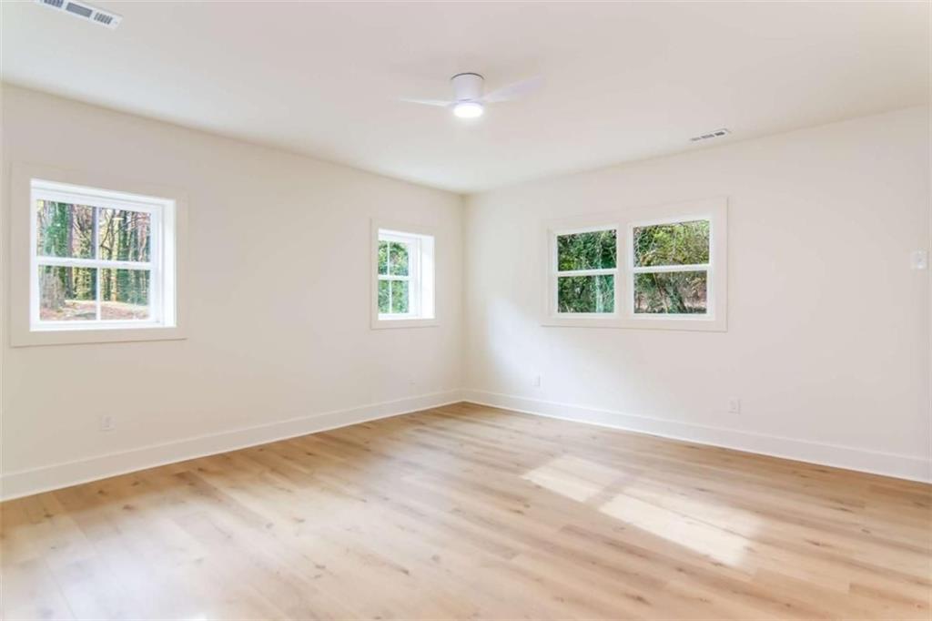 4956 Mountclaire Road Stone Mountain, GA 30087 - Photo 53 of 61 an empty room with windows