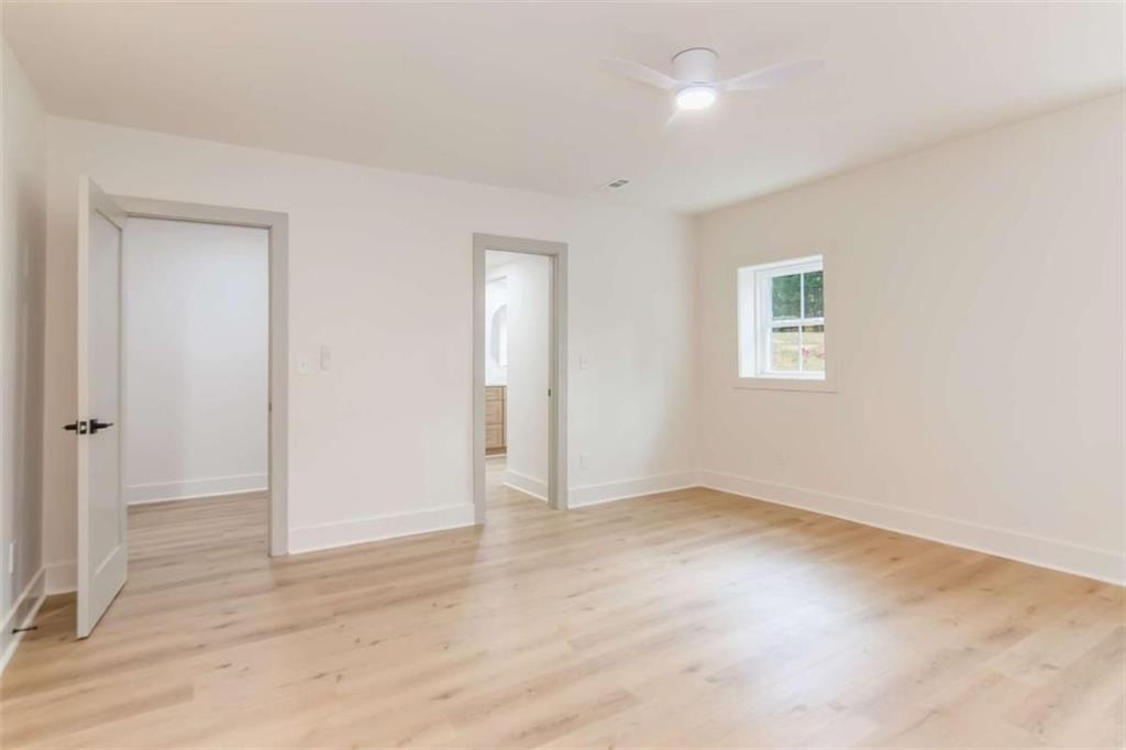 4956 Mountclaire Road Stone Mountain, GA 30087 - Photo 55 of 61 an empty room with windows and closet