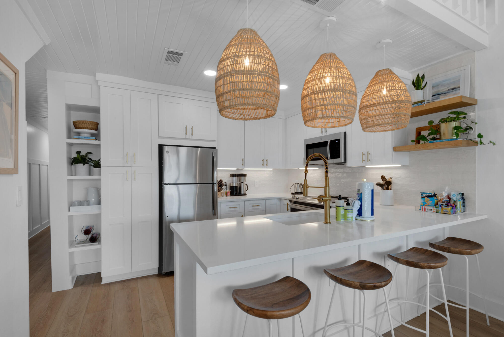 4984 West County Highway 30A, Unit 5B Santa Rosa Beach, FL 32459 - Photo 21 of 46 a kitchen with stainless steel appliances granite countertop a sink and a refrigerator
