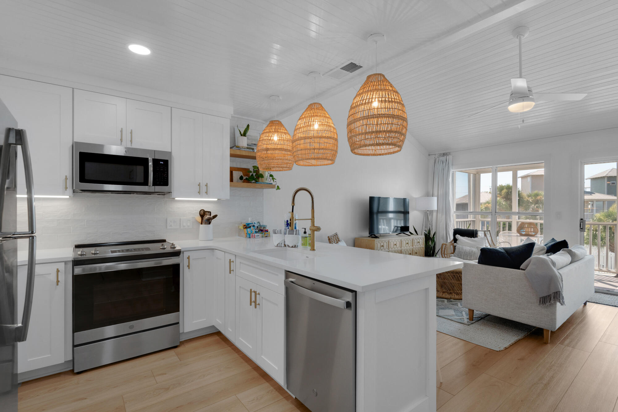 4984 West County Highway 30A, Unit 5B Santa Rosa Beach, FL 32459 - Photo 23 of 46 a kitchen with stainless steel appliances granite countertop a stove and a sink