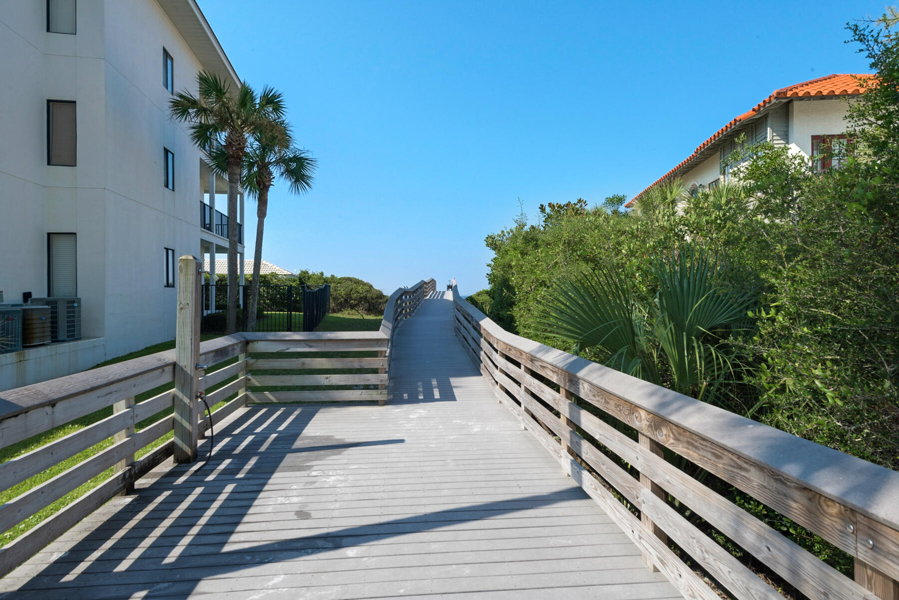 4984 West County Highway 30A, Unit 5B Santa Rosa Beach, FL 32459 - Photo 35 of 46 a view of a balcony with wooden floor and potted plants