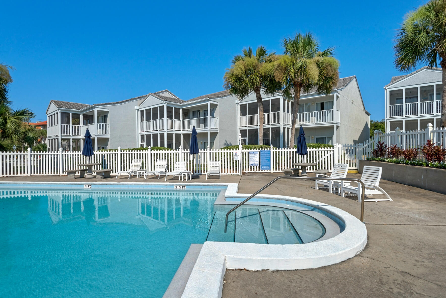 4984 West County Highway 30A, Unit 5B Santa Rosa Beach, FL 32459 - Photo 36 of 46 a view of a swimming pool with outdoor seating and plants