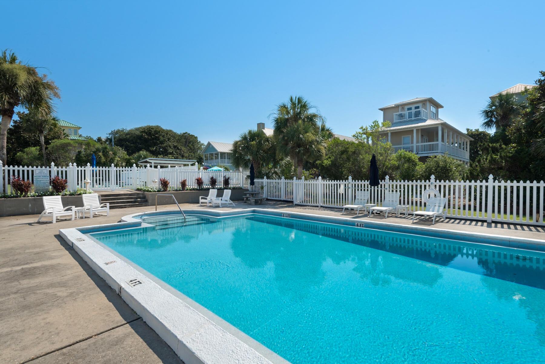 4984 West County Highway 30A, Unit 5B Santa Rosa Beach, FL 32459 - Photo 37 of 46 a view of a swimming pool and lounge chairs