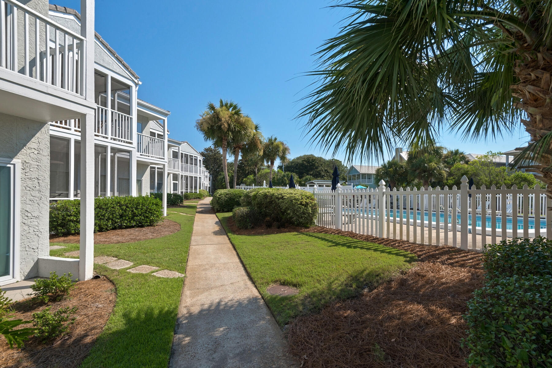 4984 West County Highway 30A, Unit 5B Santa Rosa Beach, FL 32459 - Photo 42 of 46 a view of a house with a yard and potted plants