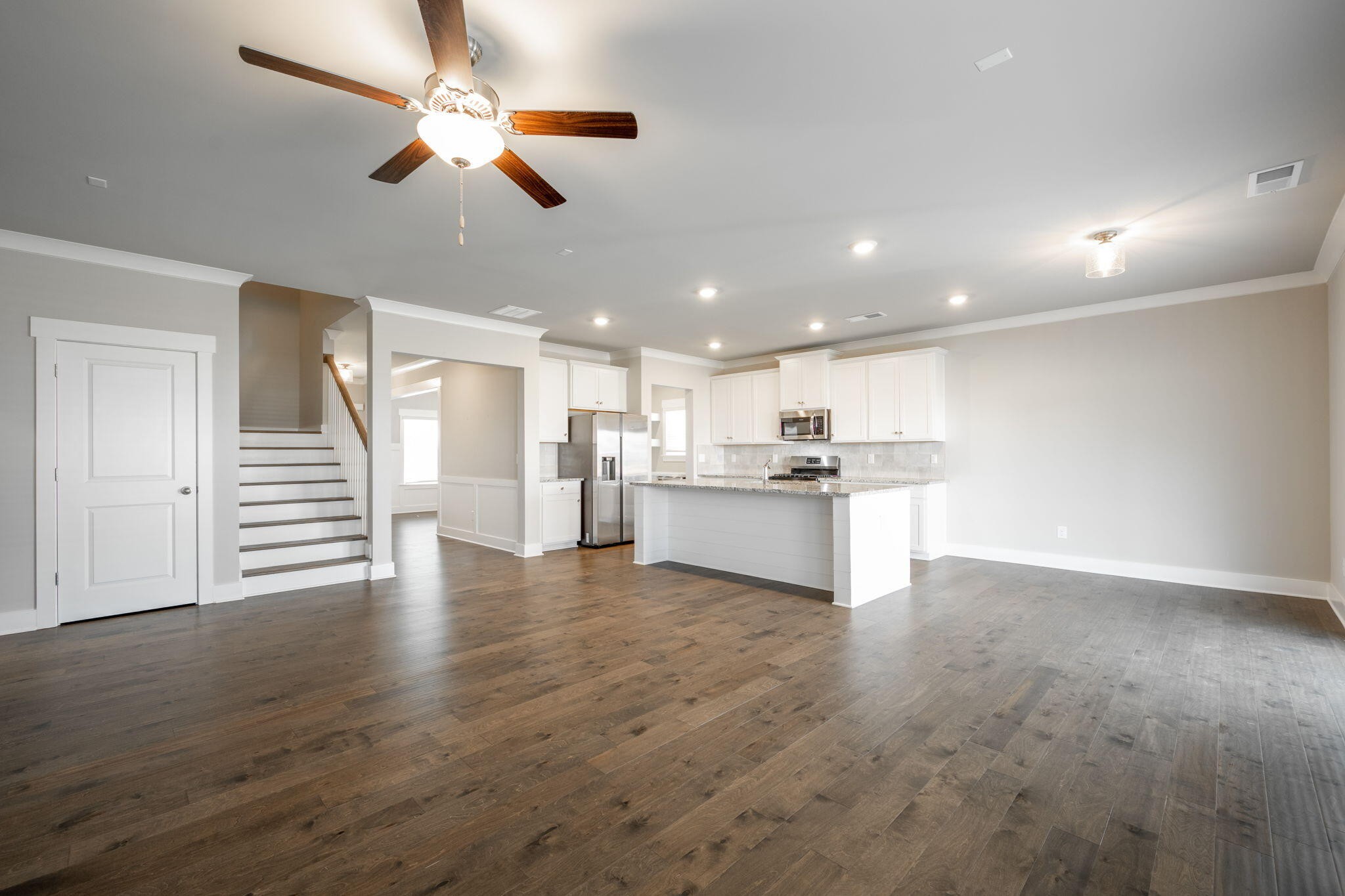 7401 McDaniel Lane Ooltewah, TN 37363 - Photo 15 of 44 a view of kitchen with kitchen island wooden floor center island and appliances