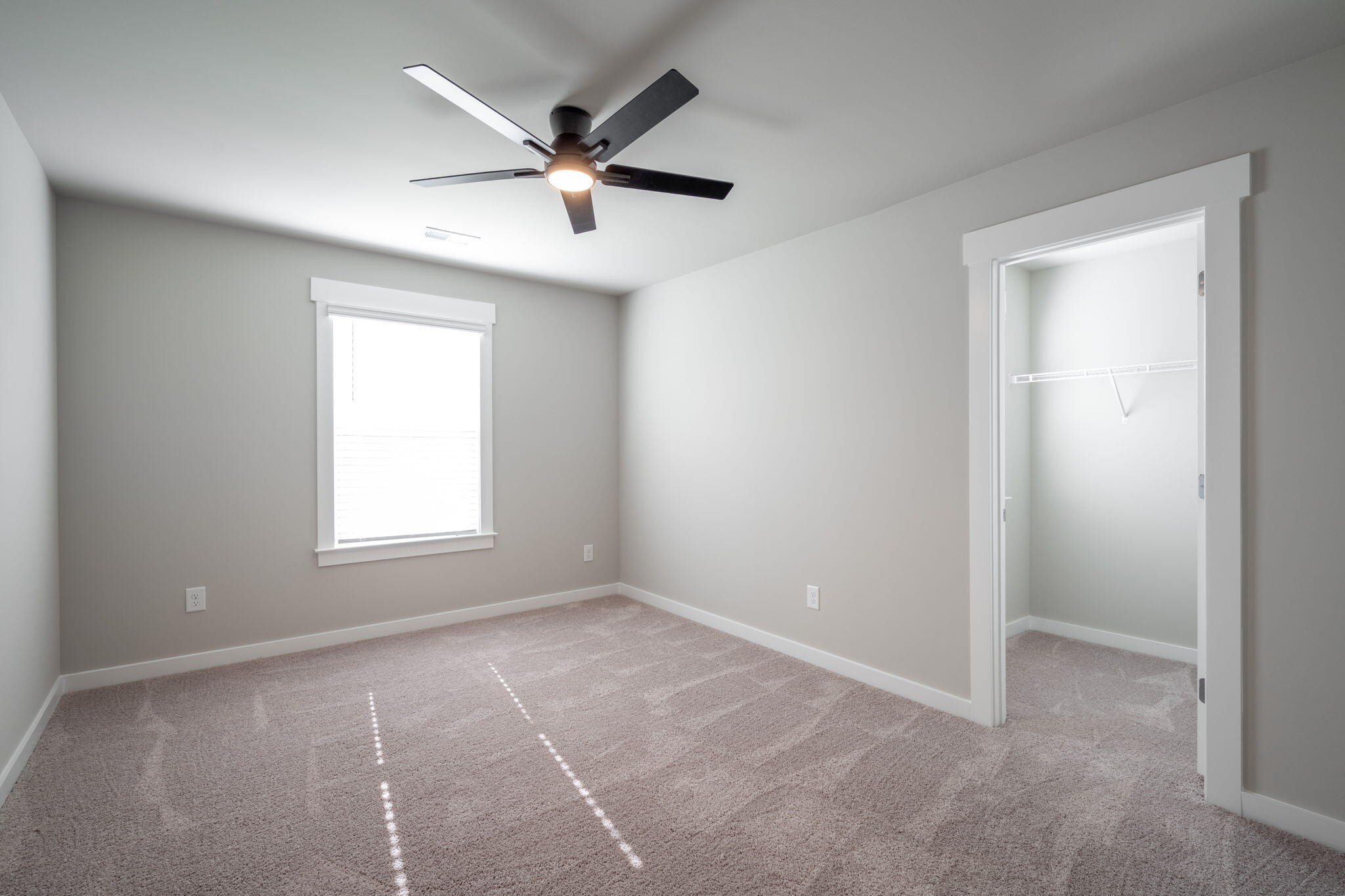 7401 McDaniel Lane Ooltewah, TN 37363 - Photo 28 of 44 an empty room with a window and a fan