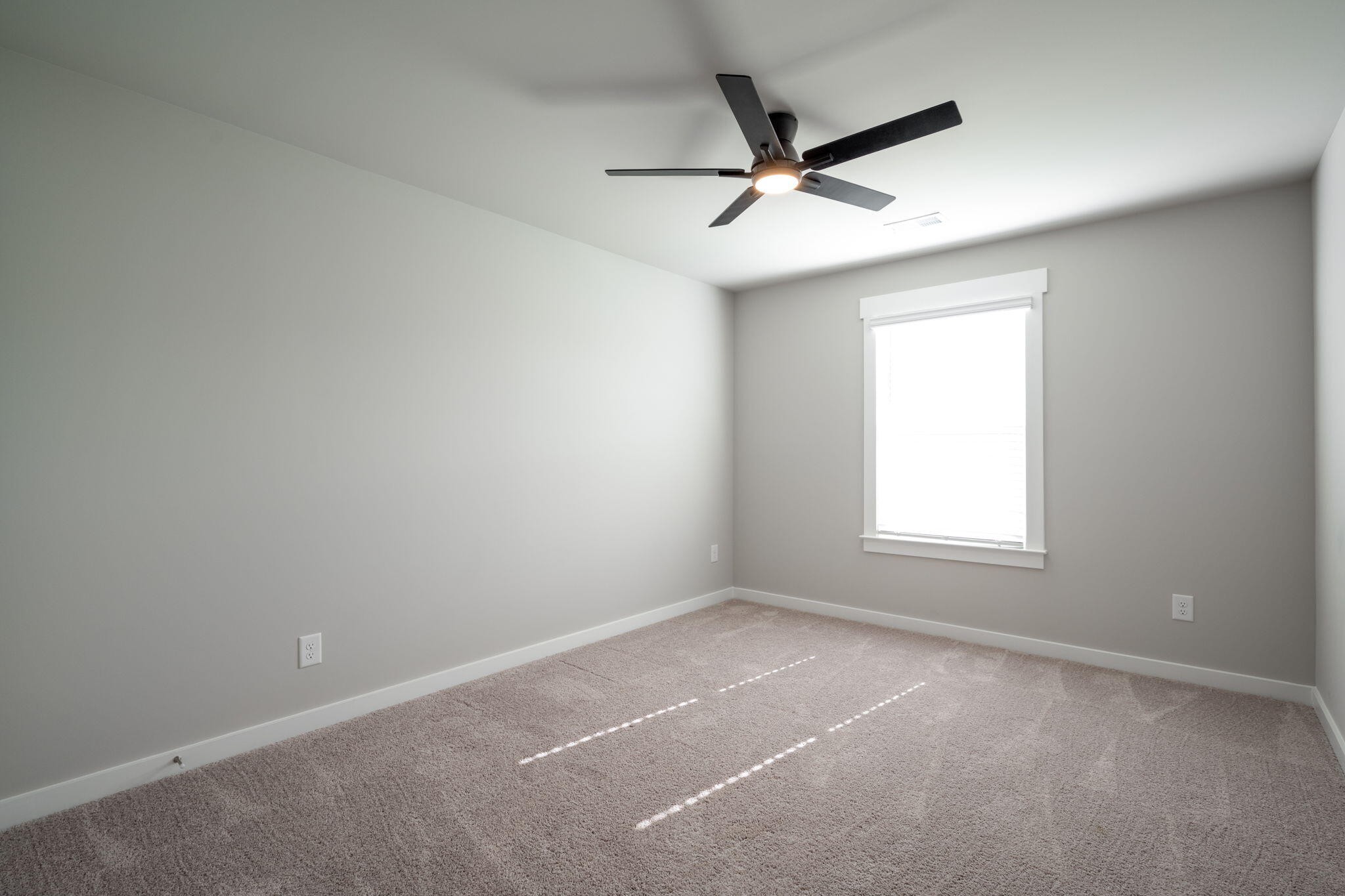 7401 McDaniel Lane Ooltewah, TN 37363 - Photo 30 of 44 an empty room with a window and a fan