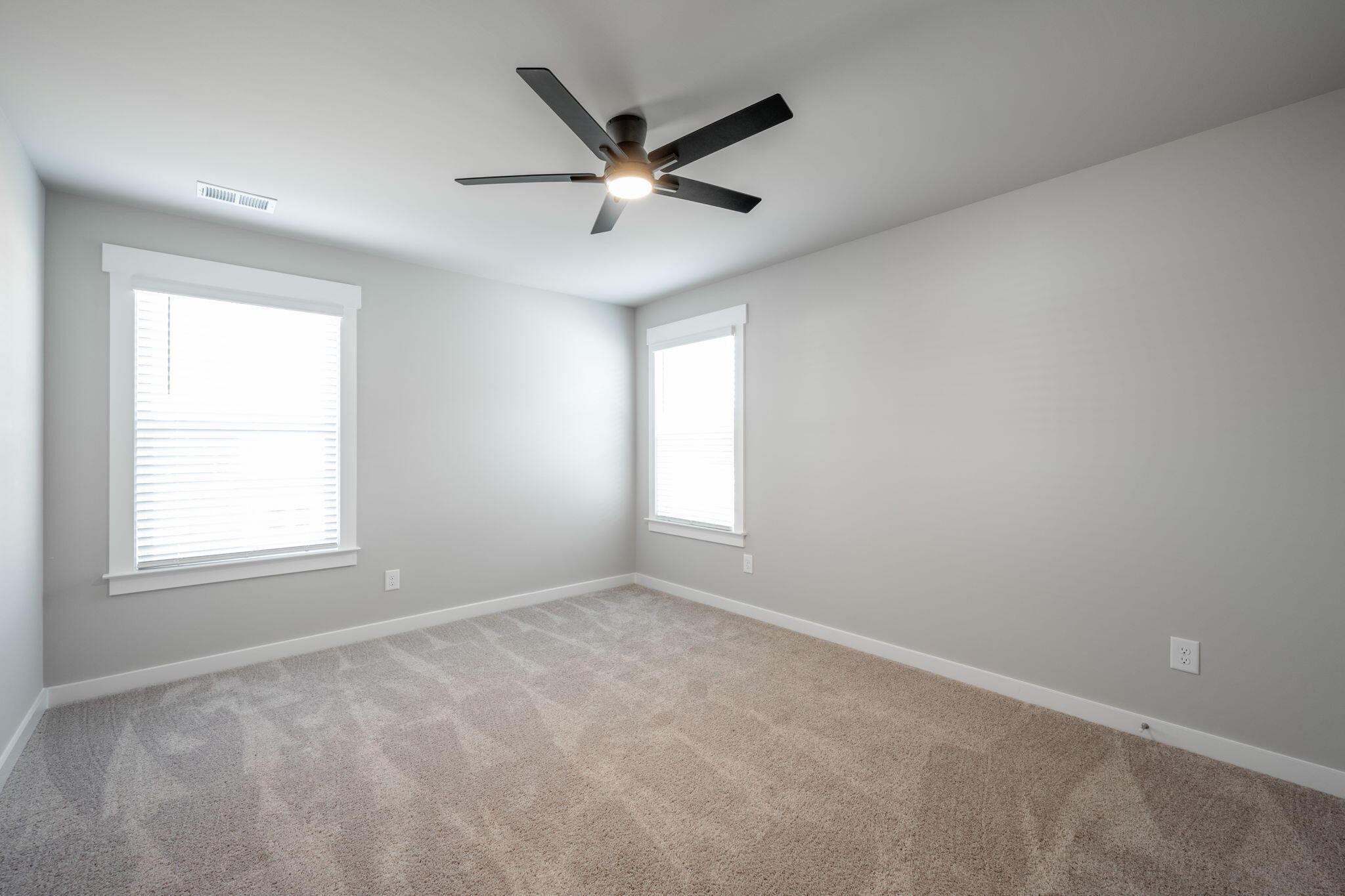 7401 McDaniel Lane Ooltewah, TN 37363 - Photo 35 of 44 an empty room with ceiling fan and windows