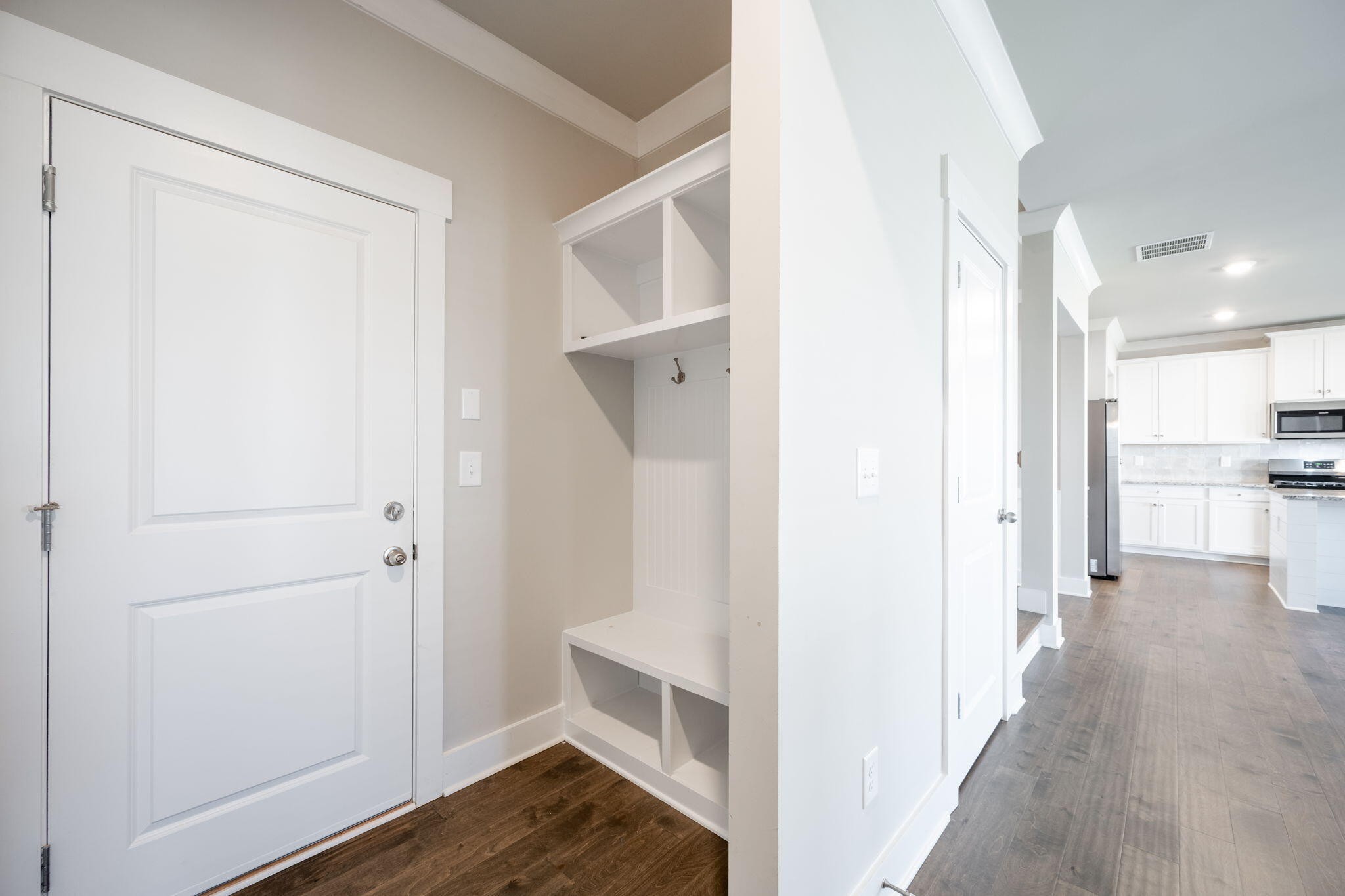 7401 McDaniel Lane Ooltewah, TN 37363 - Photo 38 of 44 a view of a hallway with wooden floor and closet