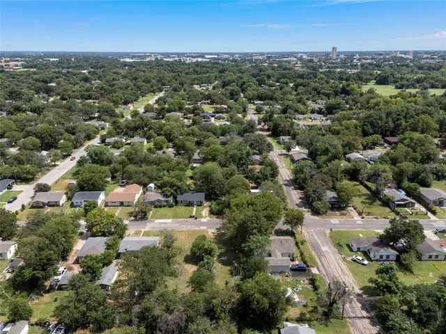 an aerial view of a city with lots of residential buildings