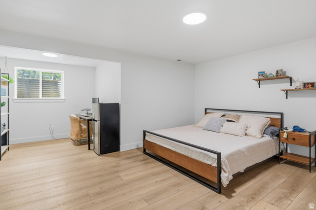 4150 Dover Lane Provo, UT 84604 - Photo 31 of 44 Spacious room with light wood-finish flooring, recessed lighting, and a window providing natural illumination