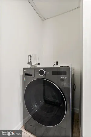 a utility room with washing machine